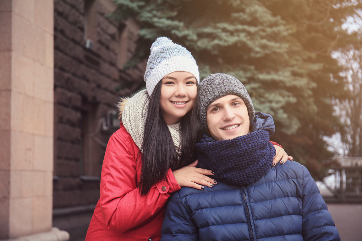 Cute Couple in Warm Clothes Outdoors